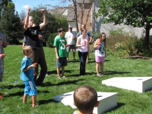 Picture of children and adults playing 